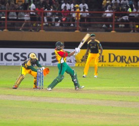  MAIN MAN! Man of-the-match Lendl Simmons smashes one of his four sixes during his unbeaten half century last night. 