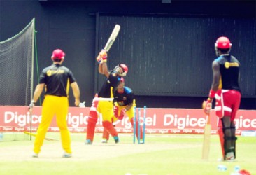 The Hawksbill team during batting sessions at the stadium yesterday