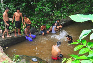 Villagers enjoying a swim at the Hosororo Falls