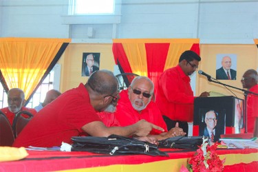 President Donald Ramotar (right) conversing with former President Bharrat Jagdeo at the PPP’s 30th Congress on Friday at Port Mourant. Not visible is Head of the Presidential Secretariat, Dr Roger Luncheon. (Arian Browne photo)