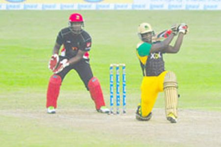 Andre Russell on the attack hitting the first of his three massive sixes. (Orlando Charles photo)