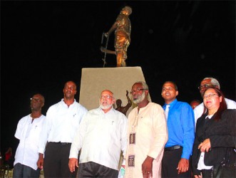 Sculptor of the 1823 monument Ivor Thom (fourth from left) flanked by President Donald Ramotar (third from left) and Culture Minister, Dr Frank Anthony 