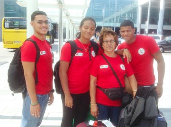 (From left –right) Guyana’s 15th FINA World Championships team in Barcelona, Spain, Niall Roberts, Britany van Lange, Coach Stephanie Fraser and Earlando McRae. 