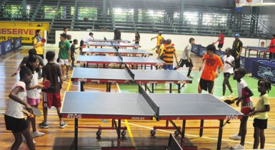 Above the some of the players are seen going through their paces at the Cliff Anderson Sports Hall. (Orlando Charles photo) 