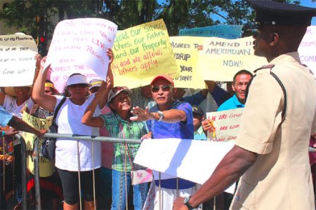 We have grievances: Amerindians from several regions protesting outside of Parliament yesterday. 