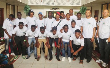 The Suriname male football team poses for a photo opportunity at the Ocean View International Hotel after arriving in Guyana to compete in the annual Inter Guiana Games. 