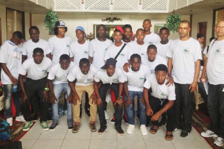 The Suriname male football team poses for a photo opportunity at the Ocean View International Hotel after arriving in Guyana to compete in the annual Inter Guiana Games.
