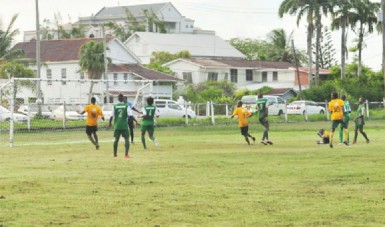  Jamal Harvey (left) scores the only goal via  a header for Guyana yesterday afternoon in their encounter with Suriname at the Police Sports Club ground, Eve Leary.