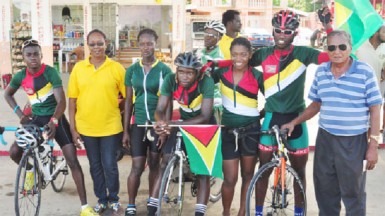 Guyana’s five- member team that dominated their Surinamese counterparts. From left Shaquel Agard, Toshawna Doris, Akeem Arthur,  Marica Dick and Hamzah Eastman. The cyclists are flanked by president of the GCF, Cheryl Thompson and National Cycling Coach, Hassan Mohamed (Orlando Charles photo) 