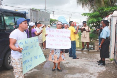 Protestors on the bridge outside the Amerindian Affairs Ministry yesterday (Photo by Arian Browne)