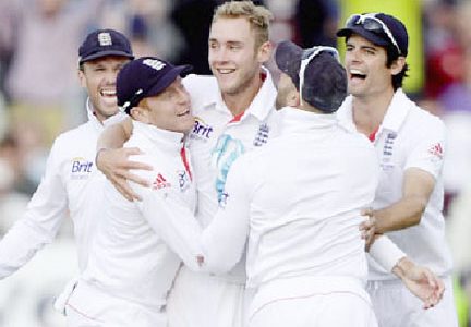 Chris Broad and his England teammates celebrate their astonishing win.