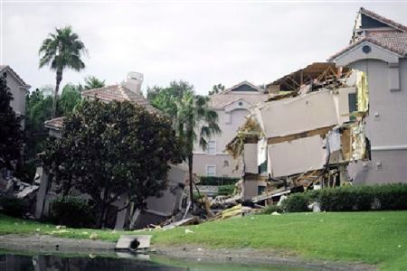 A section of the Summer Bay Resort lies collapsed after a large sinkhole opened on the property’s grounds in Clermont, Florida August 12, 2013. REUTERS/David Manning
