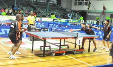 Heartbreaker! Guyana’s Jeremy Singh and Miguel Wong  right in action in the boys U13 final which they lost after leading 10-7 in the deciding game. (Orlando Charles photo) 