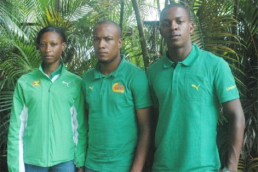 Grenada’s Kenisha Pascal (left) and Reon Radix (right) flank national coach, Kwame Hypolite, at a press briefing held at Olympic House shortly after arriving in Guyana for the fourth Boyce & Jefford Classic this weekend.