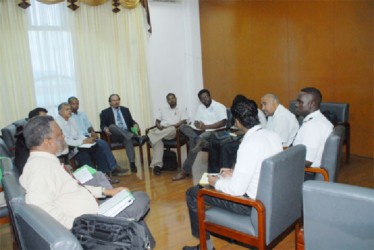 Prime Minister Samuel Hinds (foreground left) participating in the energy discussion at the National Economic Forum yesterday.