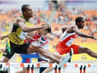  Jehue Gordon (out front in red and white) who looked impressive through the rounds of the men’s 400m hurdles 