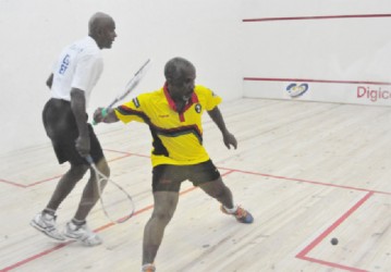 Brendon Mounter (right) of Guyana and Nigel Griffith of Barbados in action