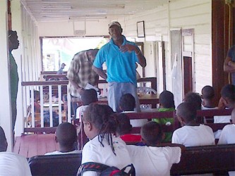 Former West Indies fast bowler Winston Benjamin sharing a few tips with the participants. 