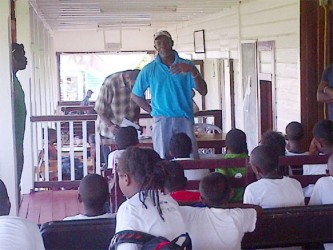 Former West Indies fast bowler Winston Benjamin sharing a few tips with the participants.