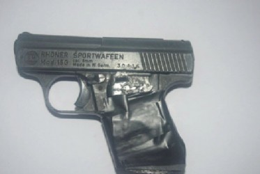 The pistol recovered by the police during a raid in Albouystown yesterday morning. (Guyana Police Force photograph)