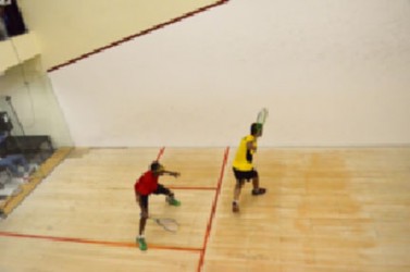 Guyana and Trinidad and Tobago players during their team playoff yesterday afternoon in the Digicel 2013 Senior Caribbean Squash Championship at the Georgetown Club. 