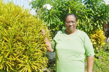 Neisha among her flower plants