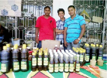 Ravi Rajkumar, his son (centre) and a friend displaying their product