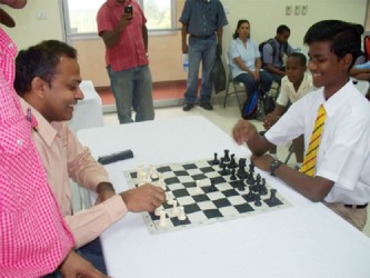 Cecil Cox is pictured here at the start of the 2011 of the National School Chess Championships with Dr Frank Anthony, Minister of Youth, Culture and Sport. 