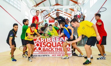 Caribbean Champs! Members of the Guyana male and female senior squash teams celebrate their overall team title triumph. (Photo courtesy of Squashsite) 