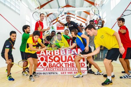 Caribbean Champs! Members of the Guyana male and female senior squash teams celebrate their overall team title triumph. (Photo courtesy of Squashsite)