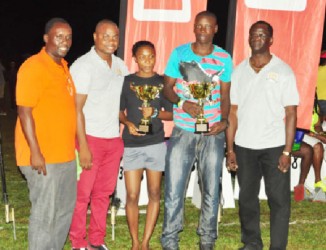 Champion male athlete, Stephan James (second right) and Champion female athlete Alita Moore pose for a photo opportunity with the organizers of the Boyce/Jefford Classic, Colin Boyce (right) and Edison Jefford (second left) along with Gavin Hope, Digicel Events and Sponsorship Manager.