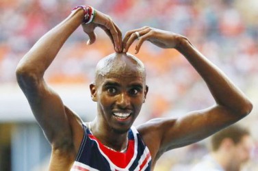 Mo Farah of Britain celebrates victory in the men’s 10,000 metres final during the IAAF World Athletics Championships at the Luzhniki stadium in Moscow earlier this month. REUTERS/Lucy Nicholson  