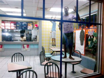 This young man took a break from dusting the restaurant’s roof to wave at the camera 