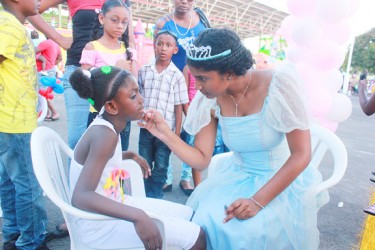 Fit for a princess:  A girl being made up at the Kids Zone at the National Park on Monday. 