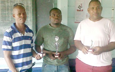 Wayne Cave along with Maurice Munro and Roberts Williams after the tournament concluded last Sunday at the Mateenoes Sports Club, Thomas Land. 