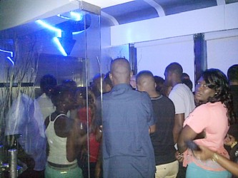 A crowd in front of the elevator serving as both entrance and exit for Gravity Lounge early Saturday morning 