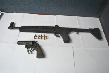 Police said both the Kel-Tec 9mm sub-machine gun with nine rounds and the .38 revolver with two rounds pictured here were recovered from the two men suspected of murdering Supply farmer Omadat Persaud. (Guyana Police Force photo) 