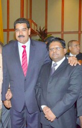 Finance Minister Dr Ashni (at left) with Venezuelan President, Nicolas Maduro during a recent meeting. 