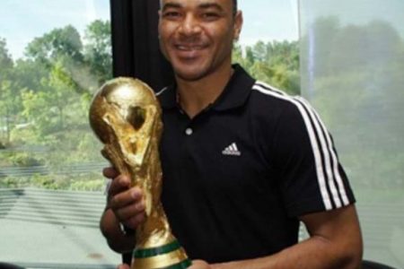 Brazilian football legend Cafu holds the FIFA World Cup Trophy during a visit to FIFA in Zurich last year. (FIFA photo)
