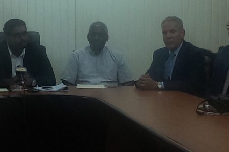 Caribbean Airlines Executives (right) during the meeting at the Ministry of Housing Boardroom 