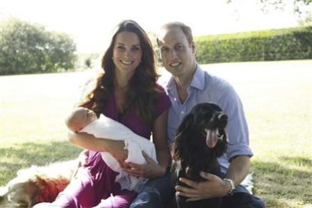 Britain's Prince William and his wife Catherine, Duchess of Cambridge, pose in the garden of the Middleton family home in Bucklebury, southern England, with their son Prince George, cocker spaniel Lupo (R) and Middleton family pet Tilly, in this undated photograph released in London August 19, 2013.
REUTERS/Michael Middleton/The Duke and Duchess of Cambridge/Handout via Reuters