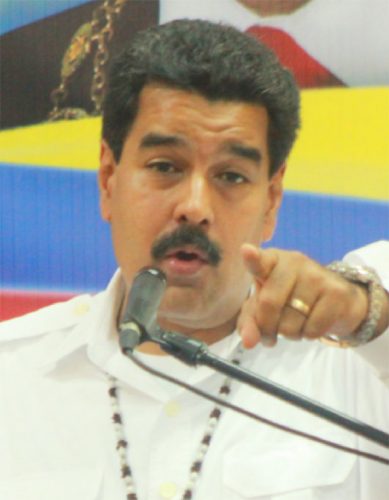 President Maduro gestures while answering a question from a reporter at the International Conference Centre yesterday. (Photo by Arian Browne)