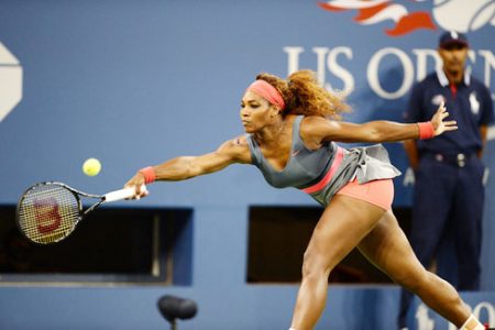 Defending US Open champion Serena Williams stretches for a forehand return during her match against Spain’s Carla Suarez Navarro which she easily won 6-0 6-0.