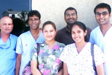 From left: Dental Technician Seeram Mohammed, Dentists  Dr Clive Jagan, Dr Shane Jagan, Dr Ian Jagan In front: Dental Assistant Ramona Subryan and Devi Louknauth, Inset:  Dr Kyle Jagan