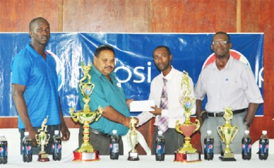 From left GCB Chairman of Senior Selectors, Rayon Griffith, GCB President Drubahadur receiving the sponsorship cheque from DDL/Pepsi brand manager, Larry Wills and GCB Chairman of competitions committee, Colin Europe. 