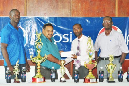 From left GCB Chairman of Senior Selectors, Rayon Griffith, GCB President Drubahadur receiving the sponsorship cheque from DDL/Pepsi brand manager, Larry Wills and GCB Chairman of competitions committee, Colin Europe. 