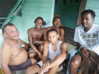 William Kippins (left) taking an afternoon drink with Devon (at back and close to the door) and others