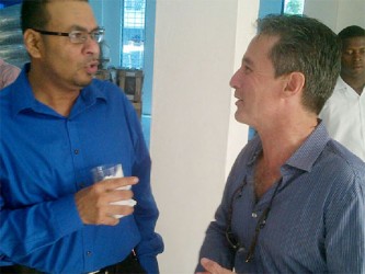 Natural Resources Minister Robert Persaud (left) and HFD investor Jarel Dawson during yesterday’s opening ceremony