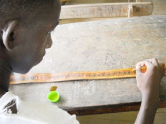 A STOMP Camp participant engrossed in craft work 