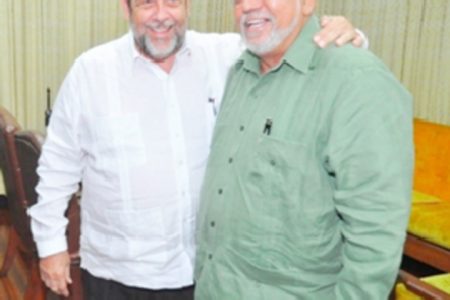 President Donald Ramotar (right) with St Vincent Prime Minister Ralph Gonsalves at the Office of the President on Monday. (GINA photo)

